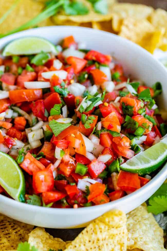 pico de gallo with lime wedges and tortilla chips.