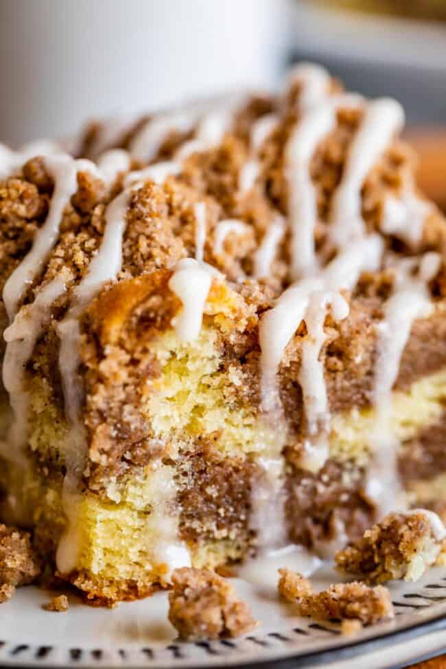 cinnamon streusel coffee cake with vanilla glaze shot up close.