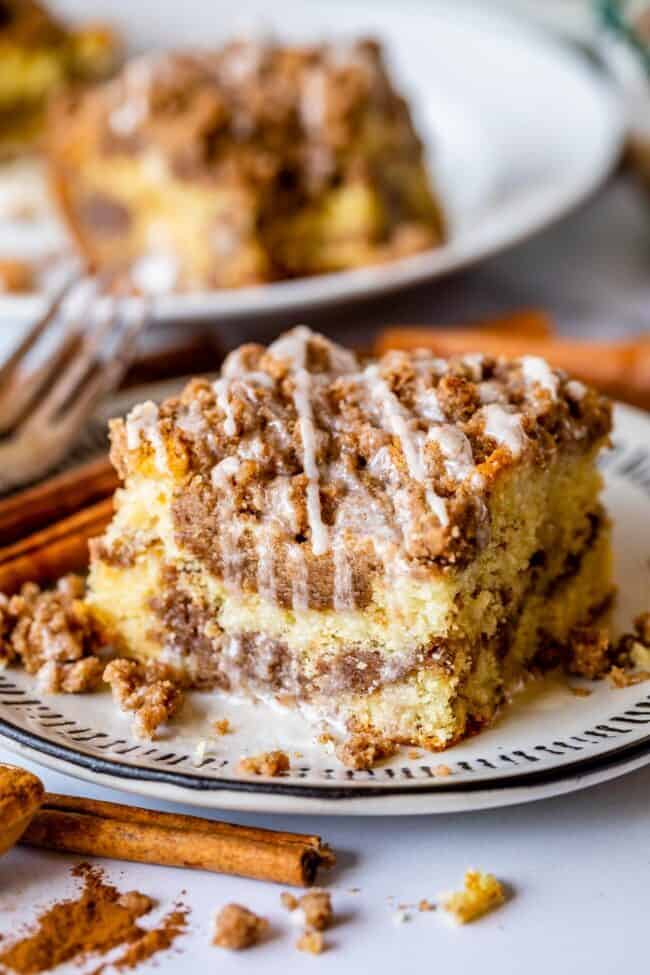 Homemade coffee cake with streusel on a white plate.