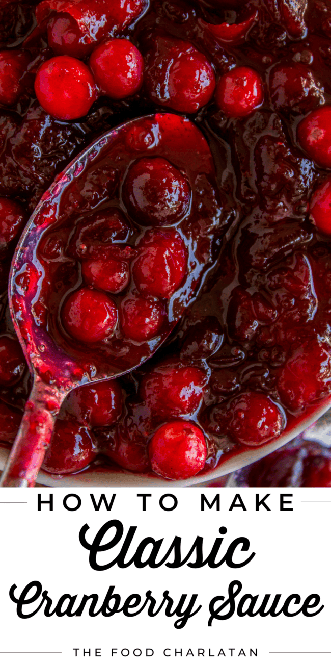 a metal spoon lifting cranberry sauce from a pot.