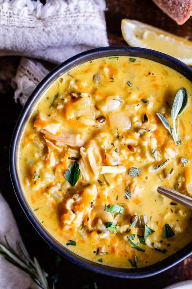 turkey and rice soup in a bowl with spoon