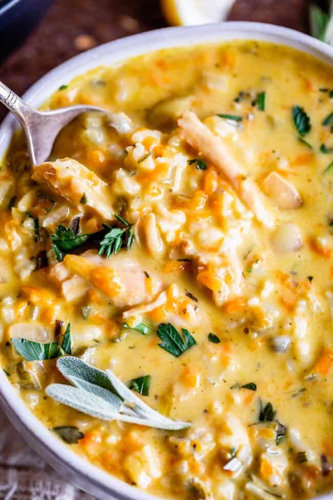 turkey wild rice soup close up with fresh herbs on top