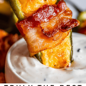dipping a bacon wrapped jalapeno popper.