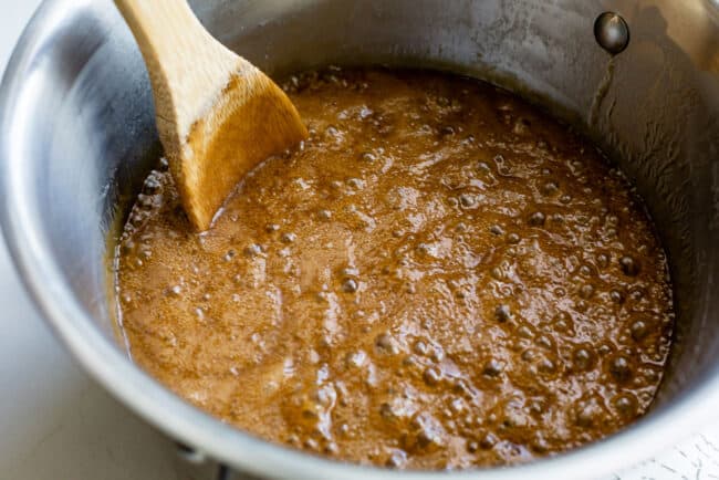 stirring boiling sugar and butter mixture for penuche fudge.