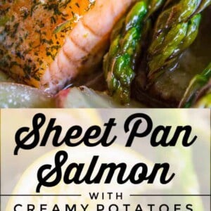 Close-up of Sheet Pan Salmon fillets with herbs, nestled among creamy potatoes and asparagus on a sheet pan. Text overlay reads: “Sheet Pan Salmon with Creamy Potatoes & Asparagus.”.