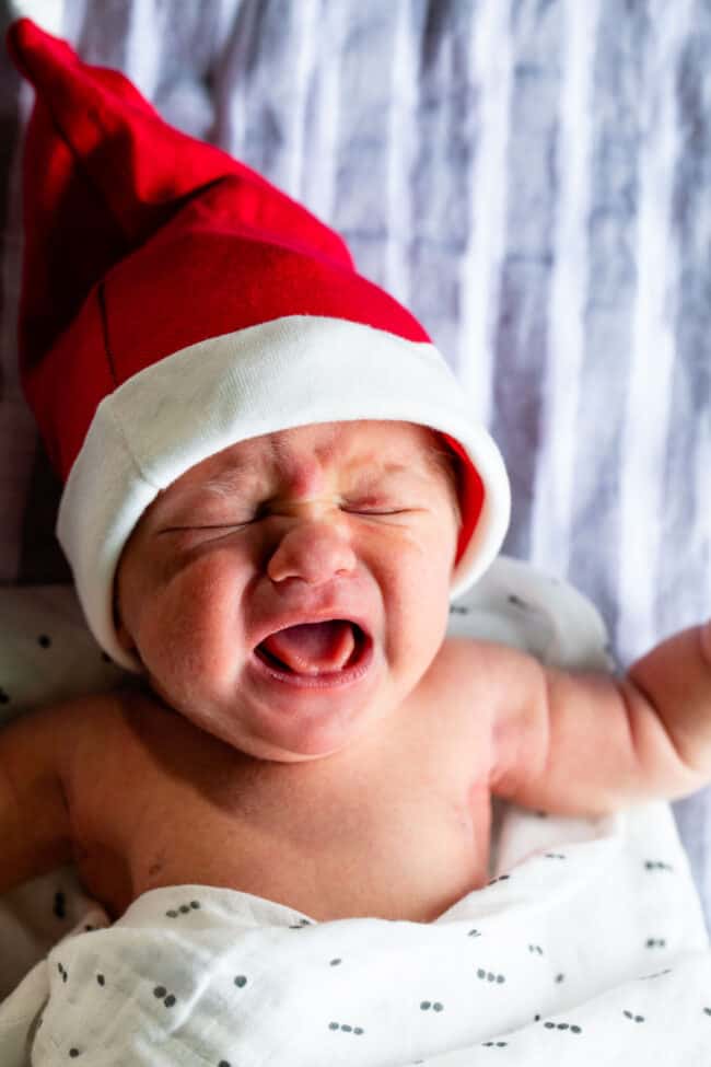 Crying baby with santa hat