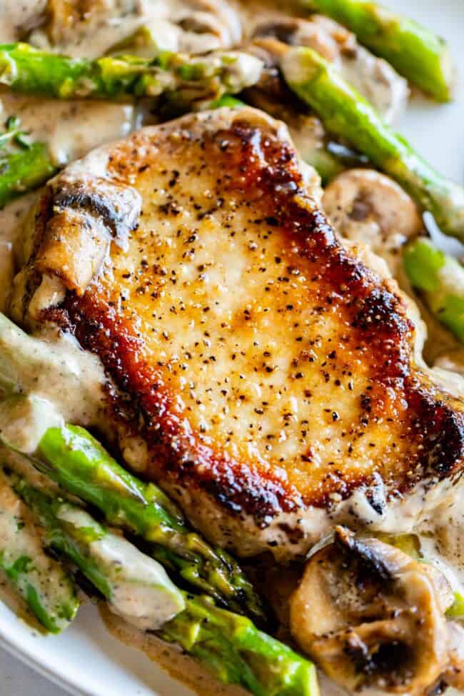 seared boneless pork chops with asparagus and mushroom and a creamy gravy.