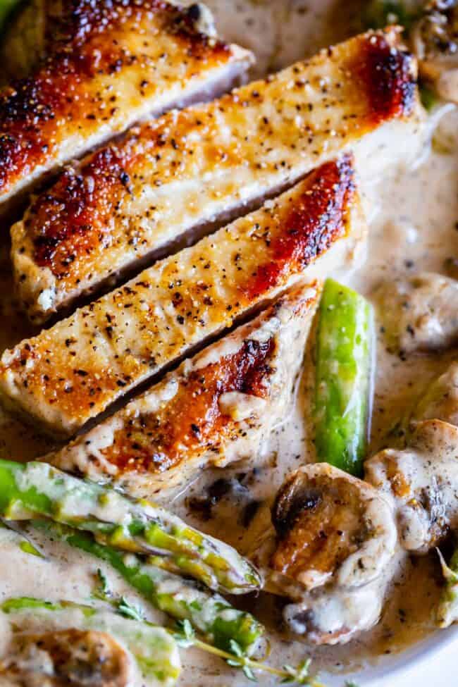 sliced pan seared pork chops with mushrooms, asparagus, and a creamy pan gravy. 