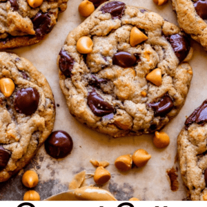 peanut butter cookies with butterscotch and chocolate chips on a baking sheet.
