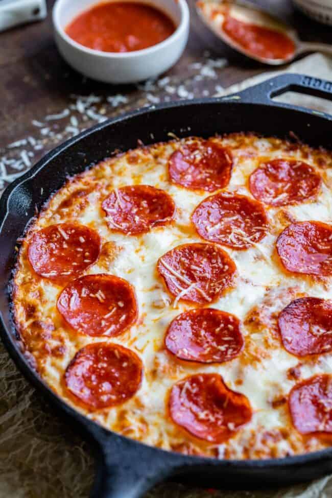 pan pizza with pepperoni baked in a cast iron skillet.