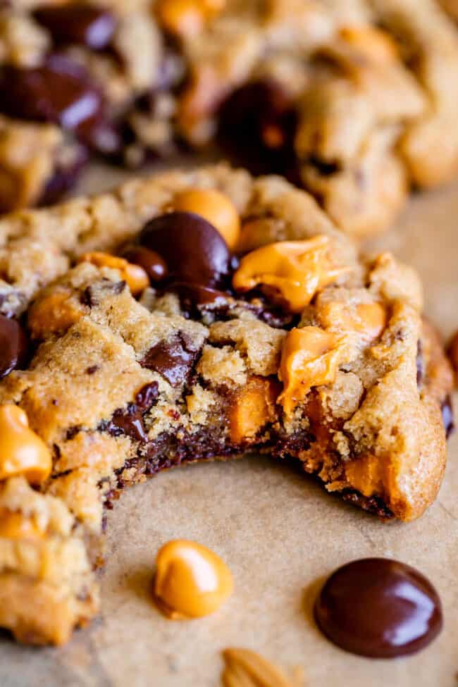 butterscotch chip cookies with a bite taken out of one.