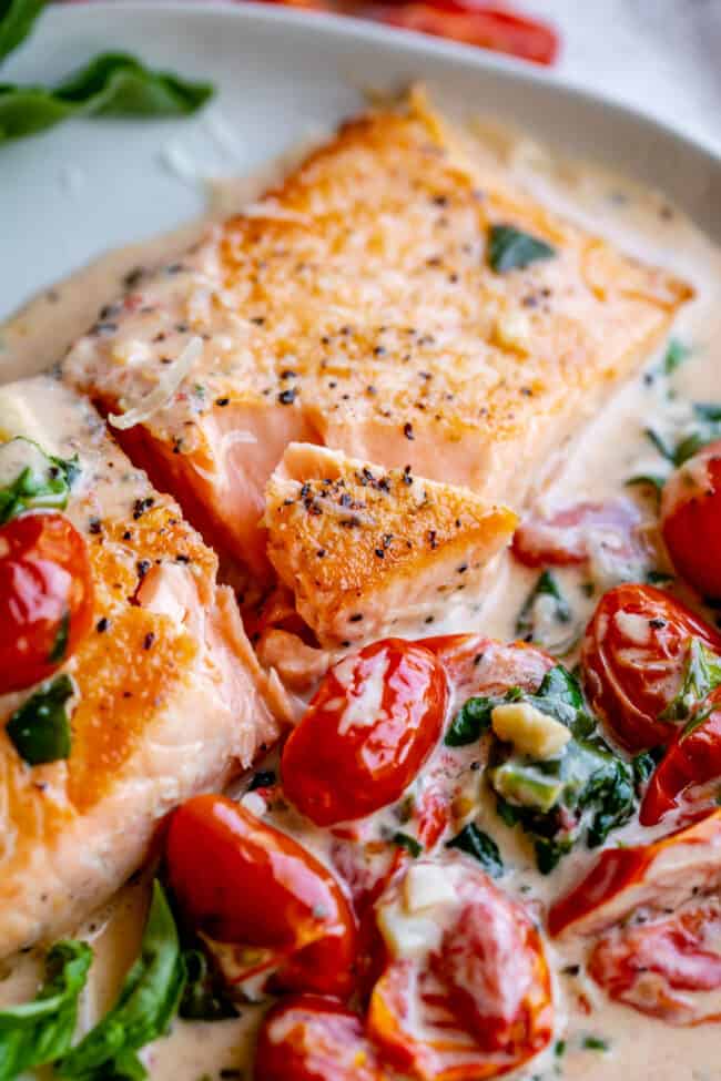 tuscan butter salmon with cherry tomatoes, spinach, and fresh basil. 