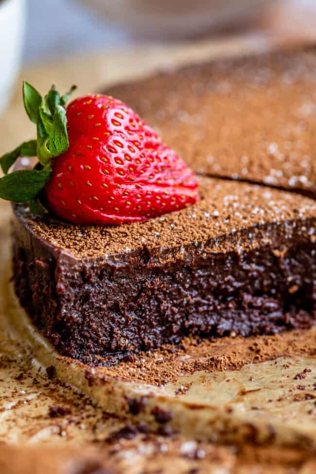 flourless chocolate cake with a strawberry on top.