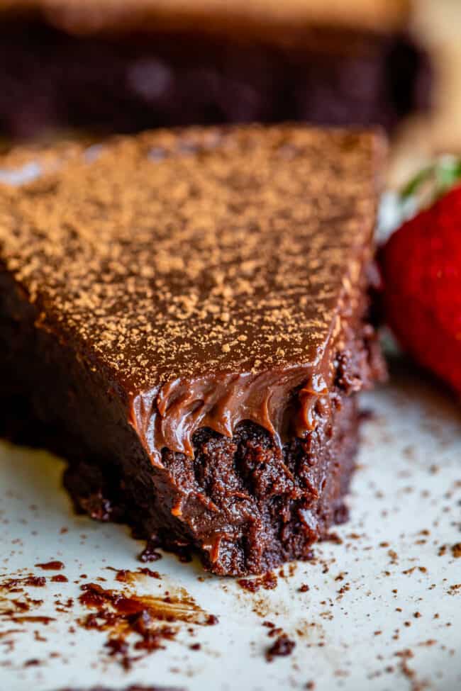 flourless chocolate cake with a forkful removed from it. 