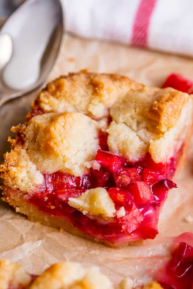 a slice of rhubarb bars with shortbread crust