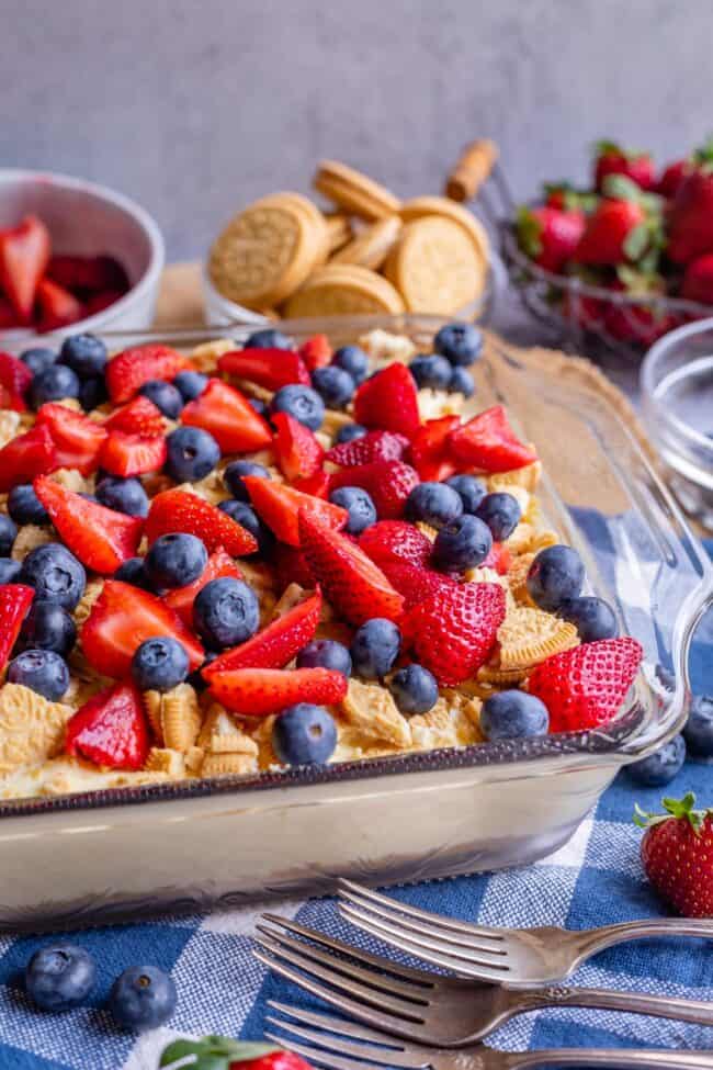 layered pudding dessert with blueberries and strawberries