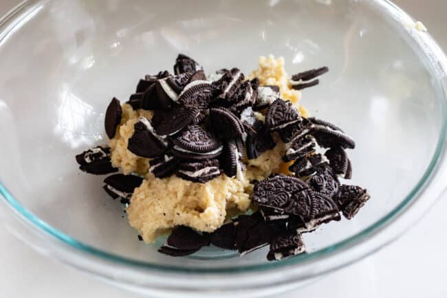 cookie dough in a bowl with Oreos mixed in