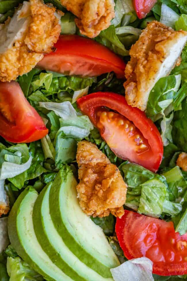 fried chicken salad with tomato and avocado