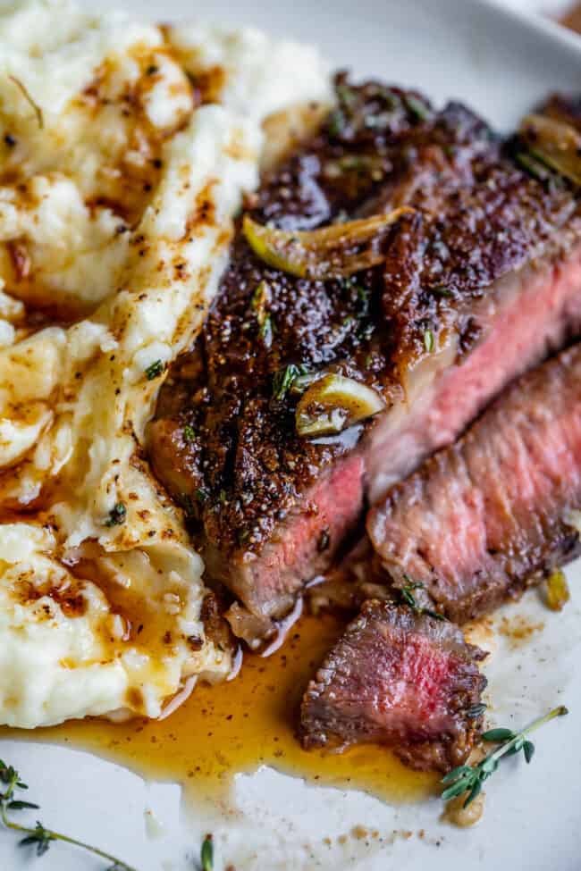 grilled ribeye steak recipe on a plate with mashed potatoes