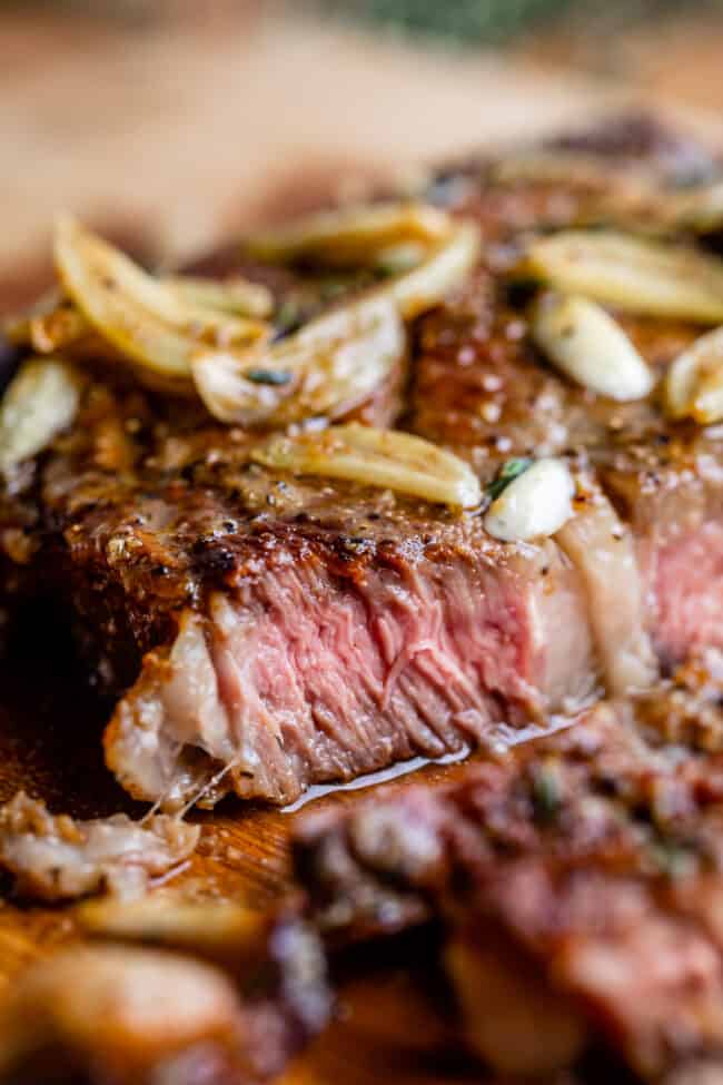 ribeye steak recipe sliced with garlic butter.