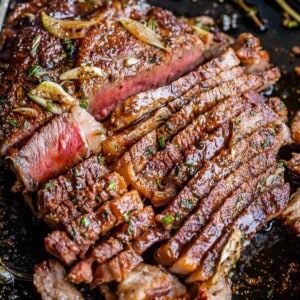 ribeye steak recipe sliced for serving, medium rare