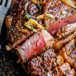 ribeye steak recipe sliced for serving, medium rare