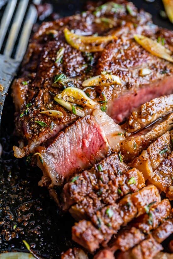 ribeye steak recipe sliced for serving, medium rare