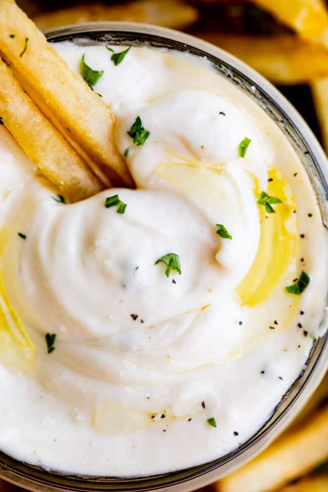 close up shot of garlic aioli recipe with french fries.