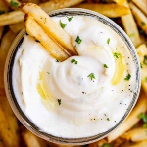 overhead shot of garlic aioli with a plate of fries