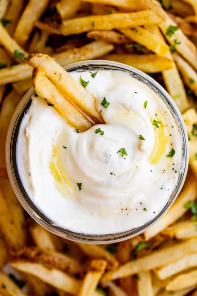 overhead shot of garlic aioli with a plate of fries
