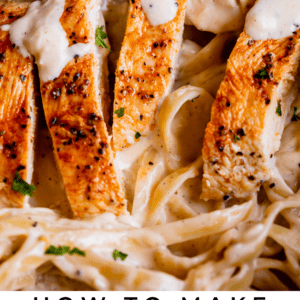 a fork with fettuccine Alfredo.