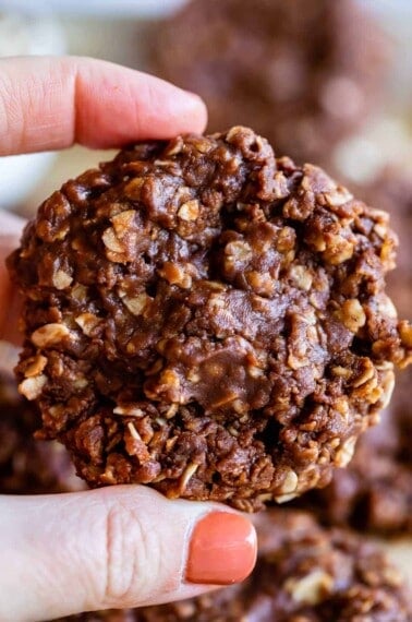 no bake chocolate peanut butter oatmeal cookies held up in hand