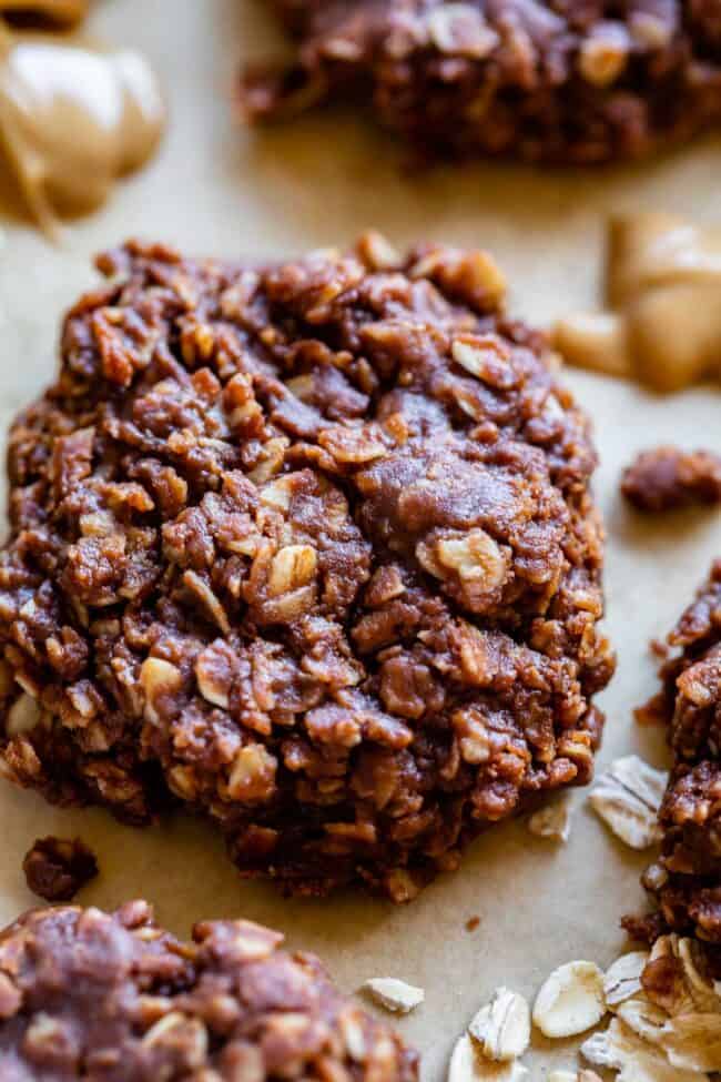 no bake peanut butter oatmeal cookies with oats on a sheet of parchment paper