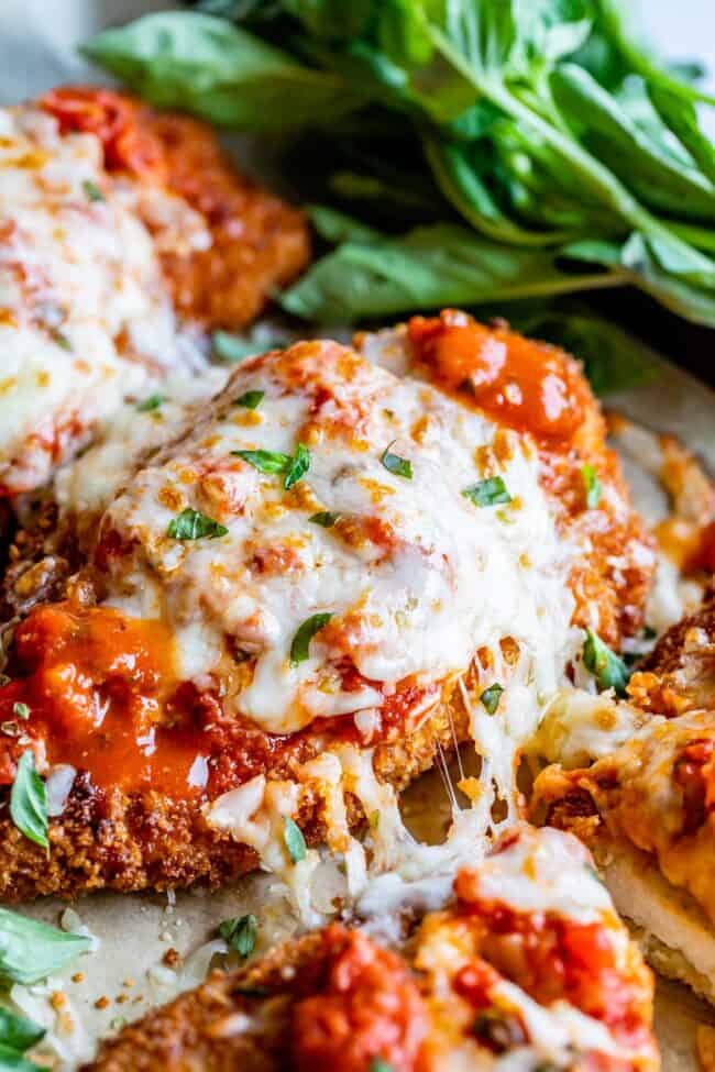 melty cheese pull on the side of breaded chicken parmesan