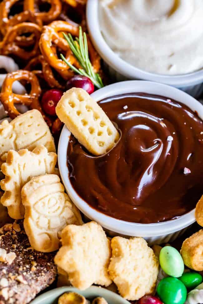 dessert board with chocolate ganache dip, shortbread, and pretzels