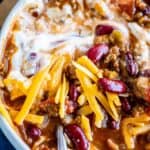 easy homemade chili in a bowl with a spoon and garnishes
