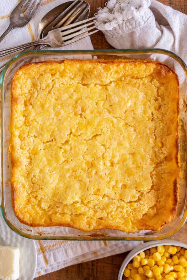 cream corn casserole recipe in a square glass pan shot from overhead.