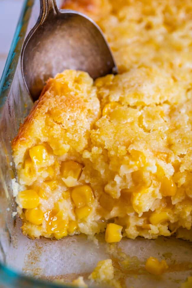 jiffy cornbread casserole in a pan with a spoon.