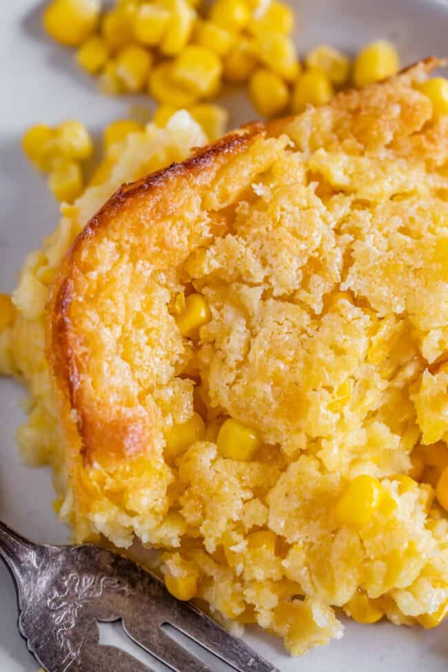 jiffy cornbread casserole on a plate with a fork.