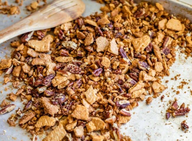 pecans and crushed graham crackers, buttered and toasted on a pan.