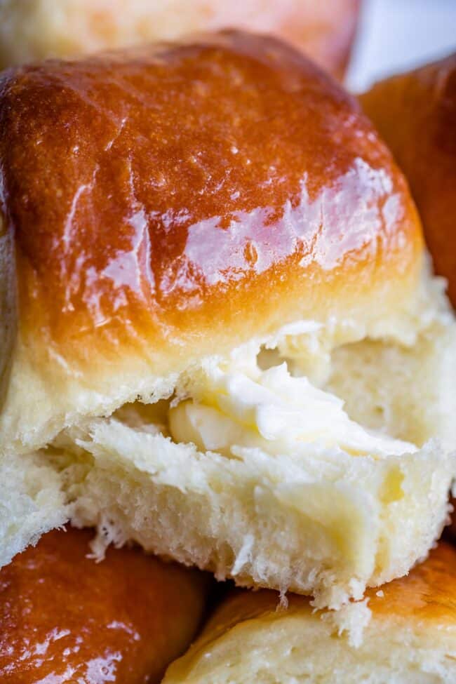 parker house roll sliced open with soft butter inside,