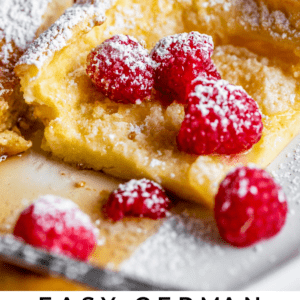 german pancakes with fresh raspberries and powdered sugar.