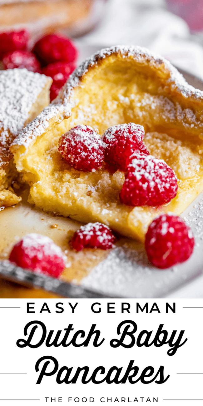 german pancakes with fresh raspberries and powdered sugar.