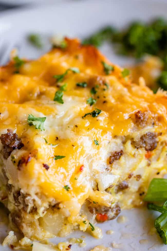 close up of make ahead breakfast casserole with a cheesy topping.
