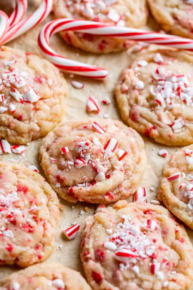 peppermint cookies recipe on a pan with parchment paper and candy canes