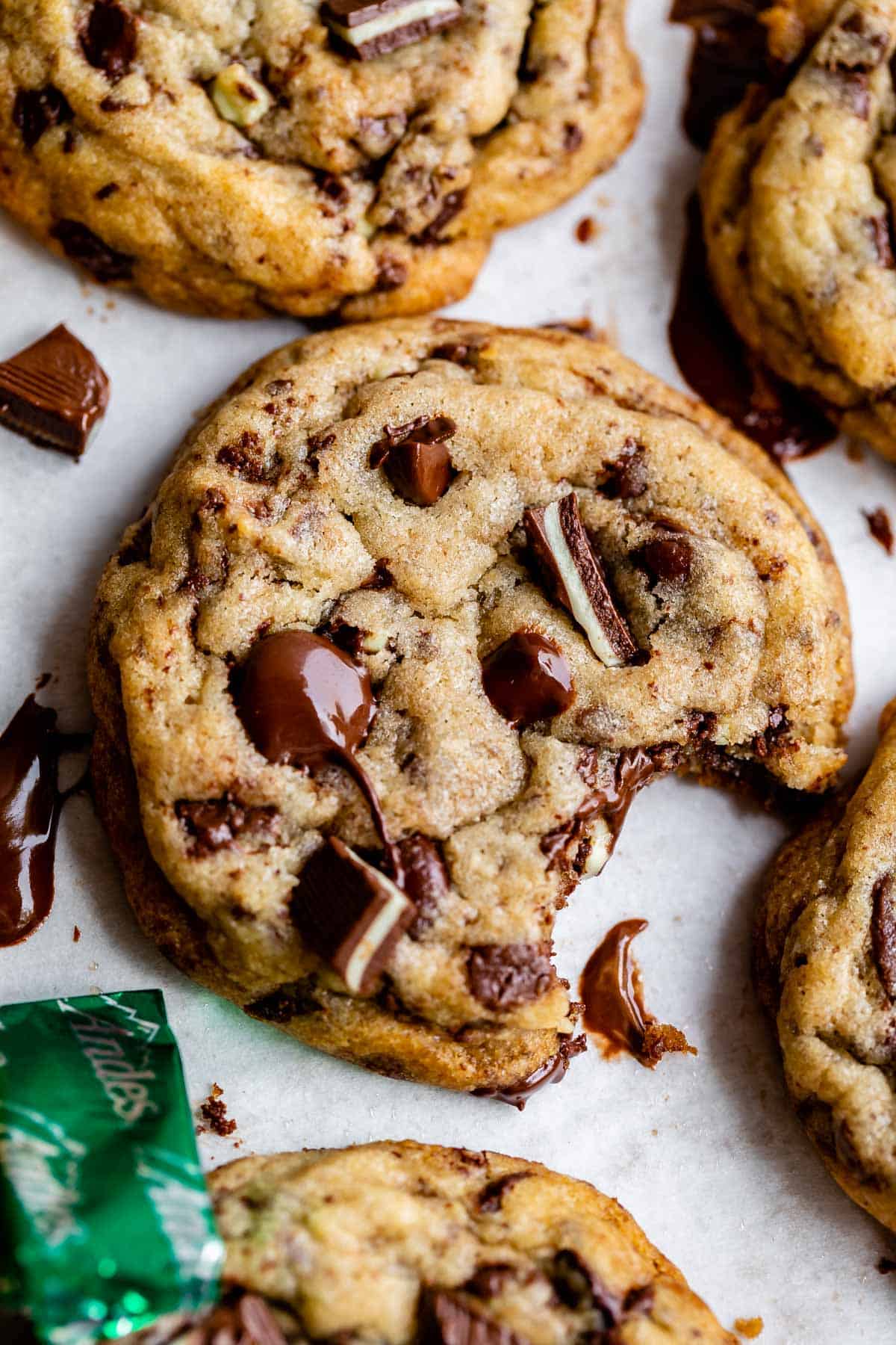 Andes mint cookies on a baking sheet with a bite taken out