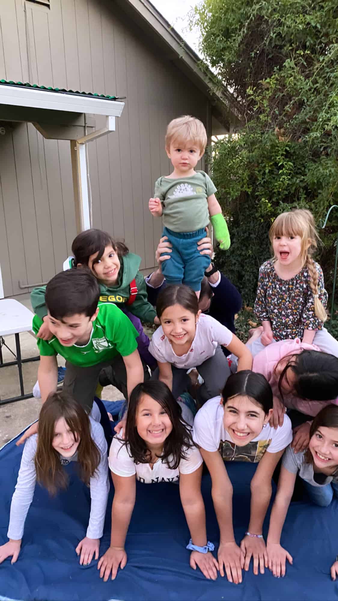 kids making a human pyramid.