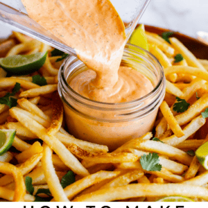 Chipotle mayonnaise is being poured from a blender into a small jar, surrounded by seasoned French fries, lime wedges, and fresh cilantro. Text at the bottom reads, Chipotle Mayonnaise with zesty flavor.