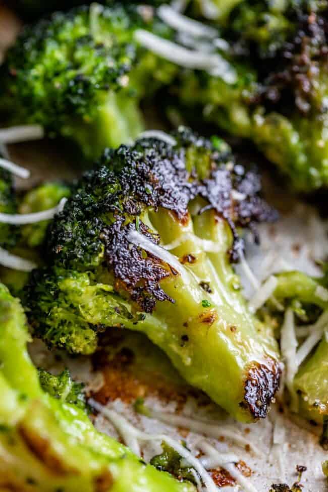 oven roasted broccoli on a sheet pan with parmesan cheese.