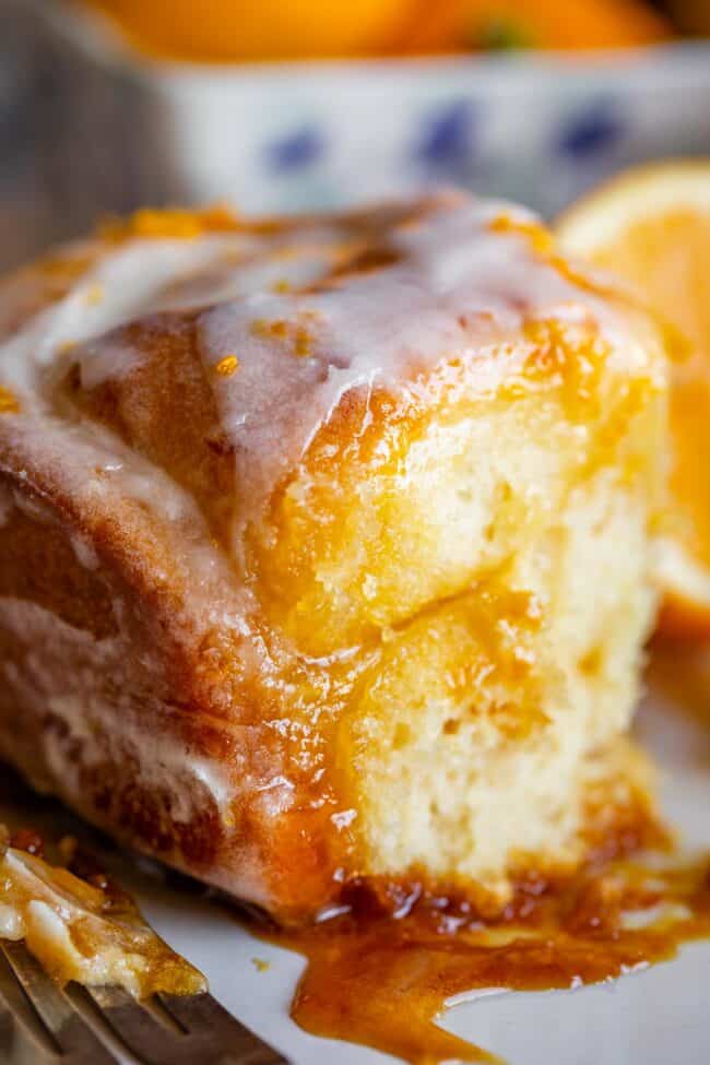 meyer lemon sweet roll on a plate with filling and glaze